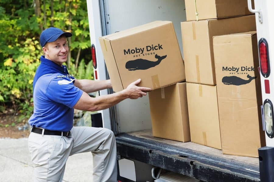 Moby Dick Pet Store mover loading branded boxes into a truck